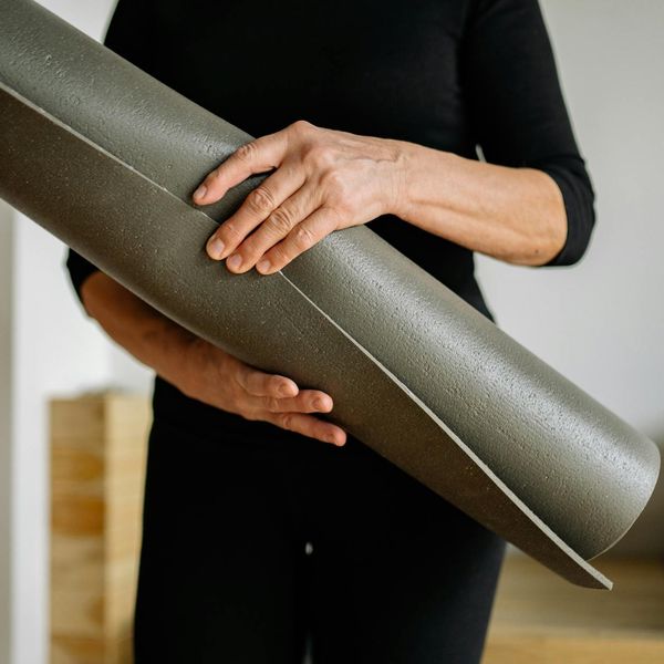 Person holding a challenging yoga pose, demonstrating strength and balance.
